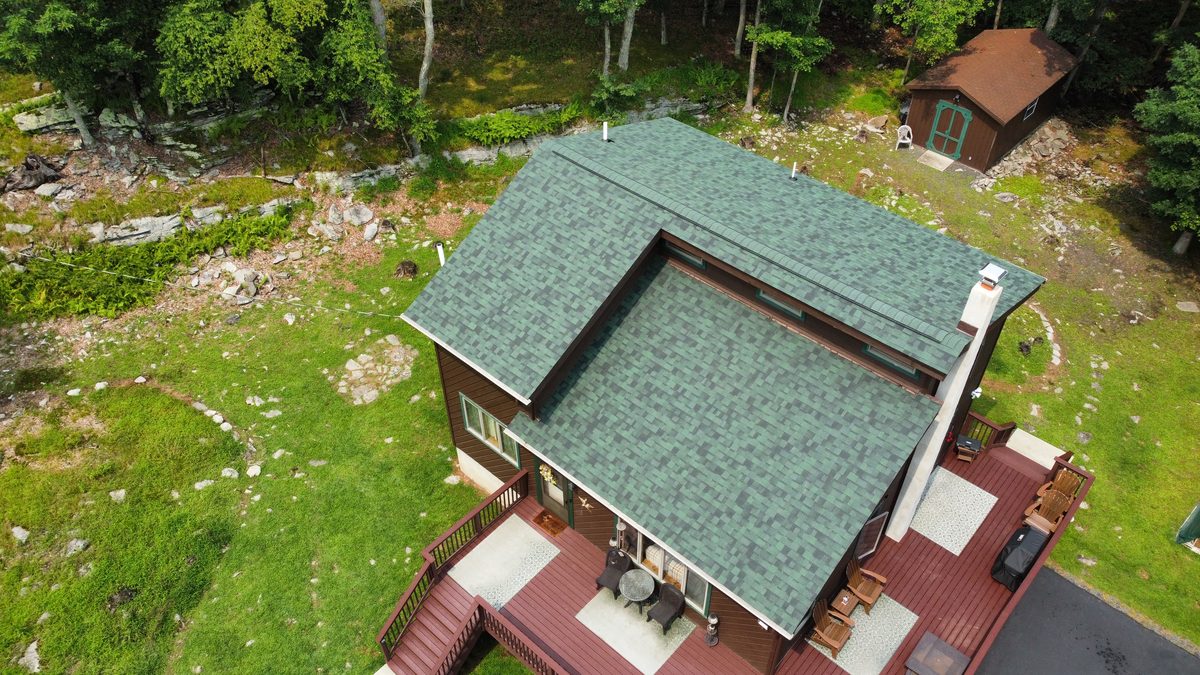 Finished roof replacement seen from above the wraparound deck