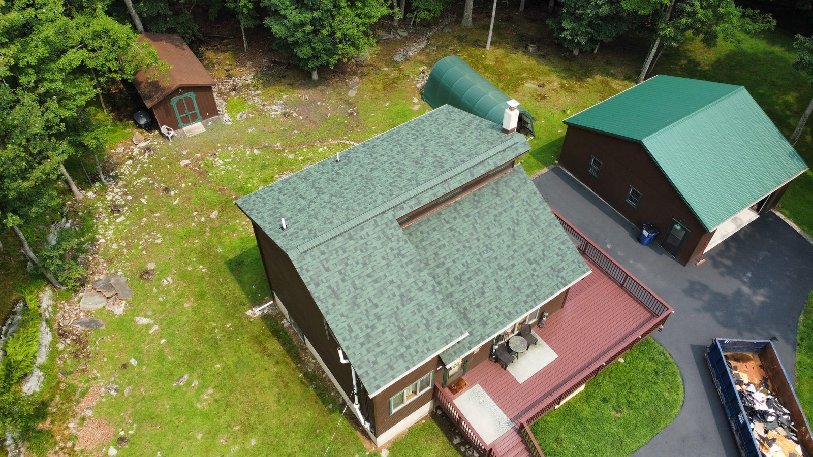 Aerial view of a completed architectural shingle roof replacement on a Pike County home